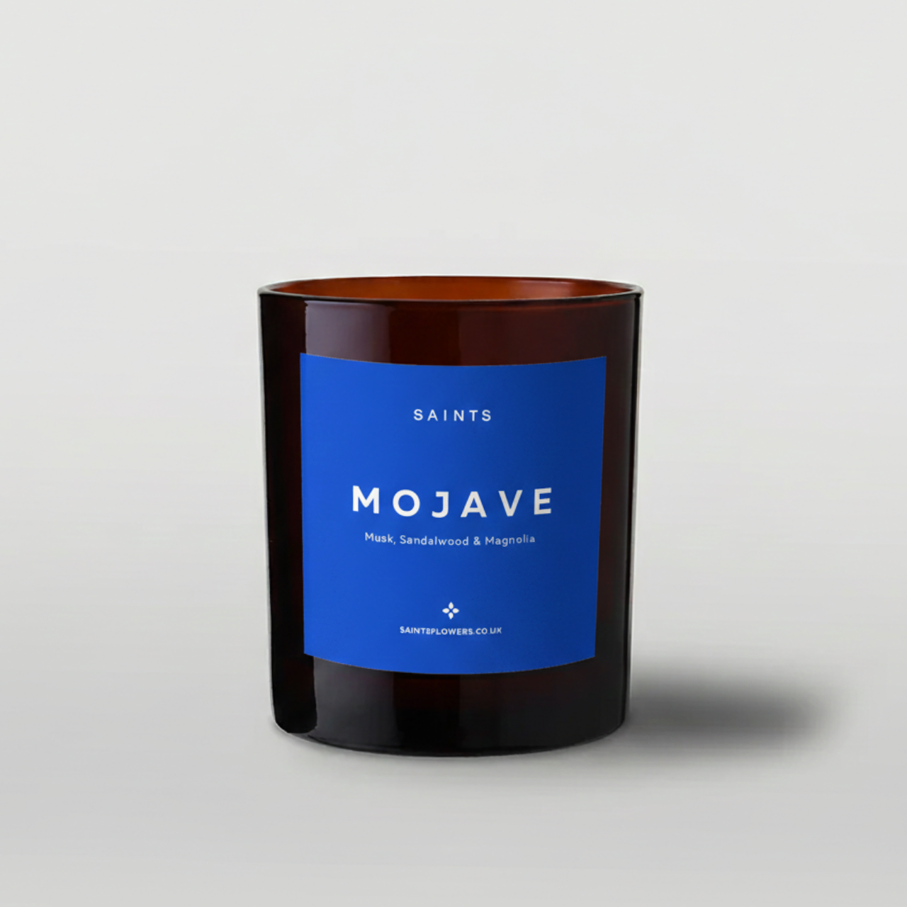 Candle with a blue label on a gray background