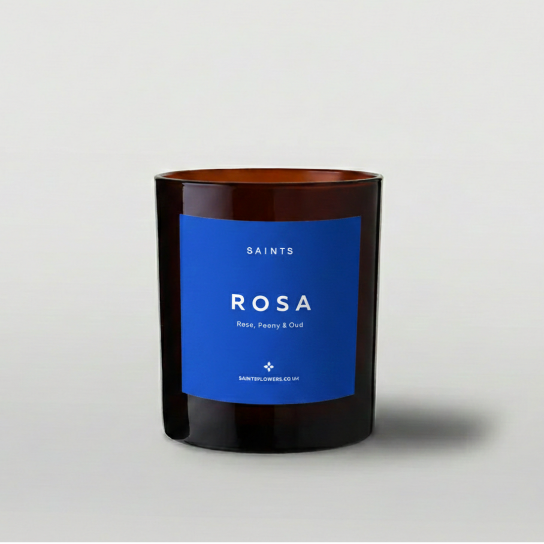 Candle with a blue label on a gray background